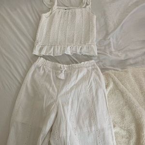 Art class a white top and white bottom.